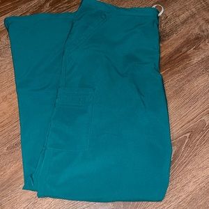 Dark teal/green scrub pants with pockets at hips and side pockets